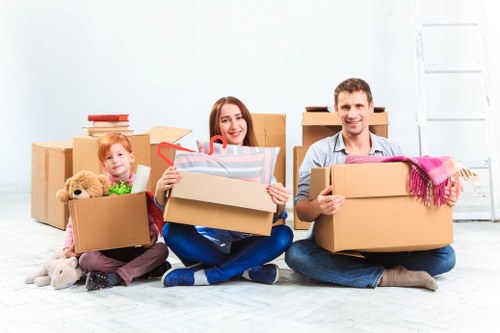 Team of movers efficiently loading a removal truck